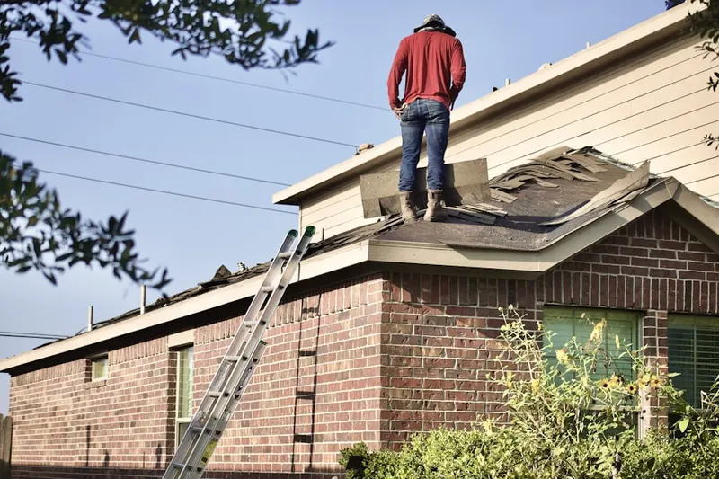 Professional roofer working on a residential roof in Jones Mill